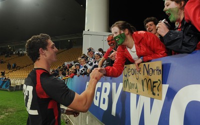 26.09.11 - Wales v Namibia - Rugby World Cup 2011 - George North meets a fan at the end of the game. 