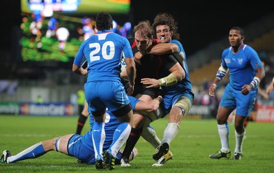 26.09.11 - Wales v Namibia - Rugby World Cup 2011 - Alun Wyn Jones of Wales is tackled by Jacques Burger of Namibia. 