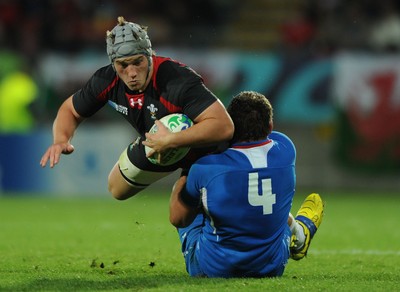26.09.11 - Wales v Namibia - Rugby World Cup 2011 - Jonathan Davies of Wales is tackled by Heinz Koll of Namibia. 
