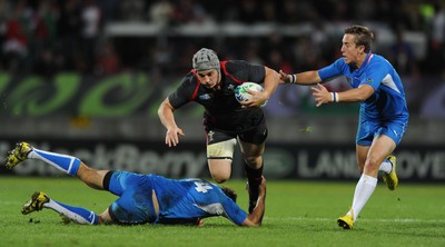 26.09.11 - Wales v Namibia - Rugby World Cup 2011 - Jonathan Davies of Wales is tackled by Heinz Koll of Namibia. 