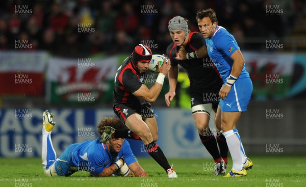 26.09.11 - Wales v Namibia - Rugby World Cup 2011 - Leigh Halfpenny of Wales gets past Jacques Burger of Namibia. 