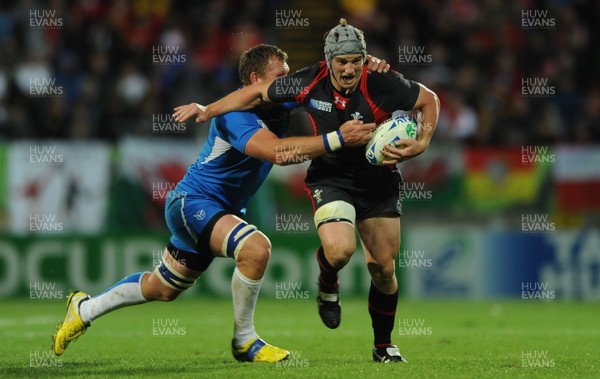 26.09.11 - Wales v Namibia - Rugby World Cup 2011 - Jonathan Davies of Wales is tackled by Heinz Koll of Namibia. 