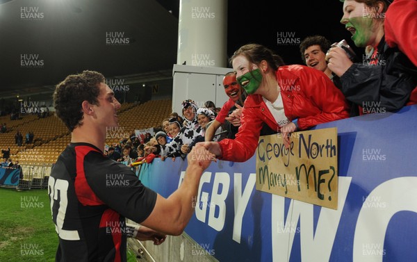 26.09.11 - Wales v Namibia - Rugby World Cup 2011 - George North meets a fan at the end of the game. 