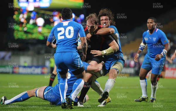 26.09.11 - Wales v Namibia - Rugby World Cup 2011 - Alun Wyn Jones of Wales is tackled by Jacques Burger of Namibia. 