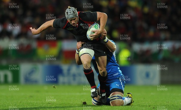 26.09.11 - Wales v Namibia - Rugby World Cup 2011 - Jonathan Davies of Wales is tackled by Heinz Koll of Namibia. 