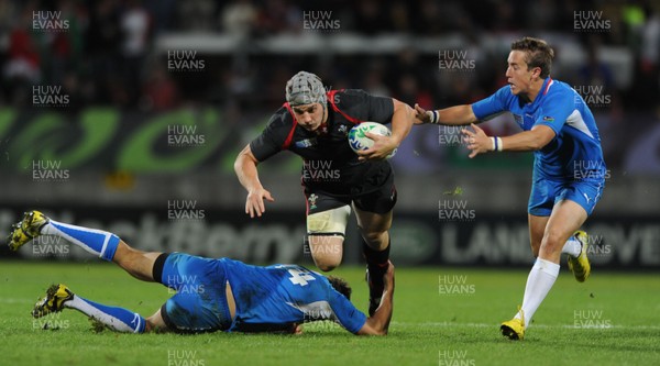 26.09.11 - Wales v Namibia - Rugby World Cup 2011 - Jonathan Davies of Wales is tackled by Heinz Koll of Namibia. 