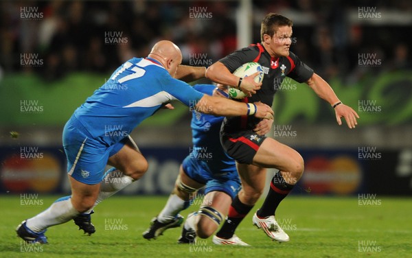 26.09.11 - Wales v Namibia - Rugby World Cup 2011 - Tavis Knoyle of Wales is tackled by Raoul Larson of Namibia. 