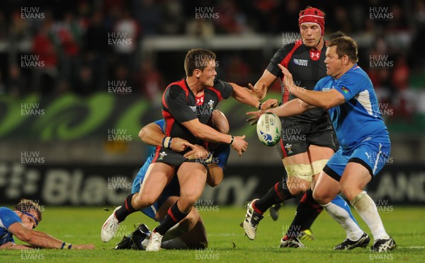 26.09.11 - Wales v Namibia - Rugby World Cup 2011 - Tavis Knoyle of Wales tries to get the ball away. 