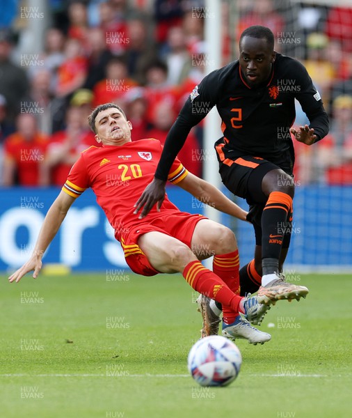 080622 - Wales v Netherlands, UEFA Nations League - Dan James of Wales is tackled by Jordan Teze of Netherlands