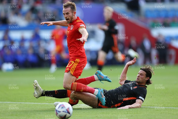 080622 - Wales v Netherlands, UEFA Nations League - Rhys Norrington-Davies of Wales is tackled by Daley Blind of Netherlands