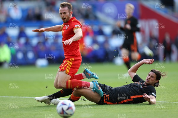 080622 - Wales v Netherlands, UEFA Nations League - Rhys Norrington-Davies of Wales is tackled by Daley Blind of Netherlands