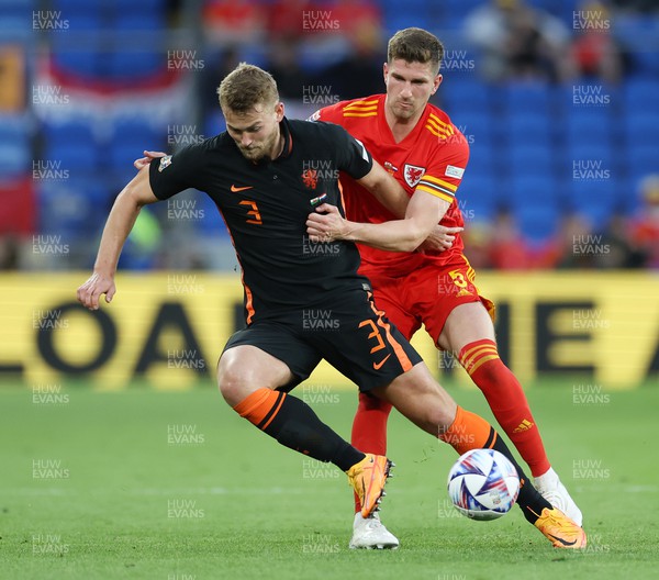 080622 - Wales v Netherlands, UEFA Nations League - Matthijs De Ligt of Netherlands is tackled by Chris Mepham of Wales