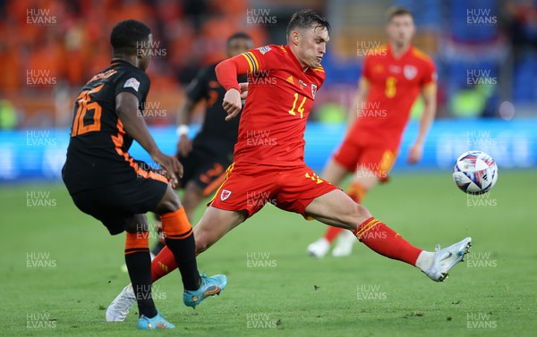 080622 - Wales v Netherlands, UEFA Nations League - Tyrell Malacia of Netherlands is challenged by Connor Roberts of Wales