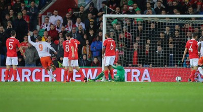 131115 - Wales v Netherlands, Vauxhall International Friendly - Bas Dost of Netherlands puts the ball past Wales goalkeeper Wayne Hennessy to score goal