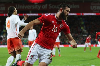 131115 - Wales v Netherlands, Vauxhall International Friendly - Joe Ledley of Wales celebrates scoring after Joe Allen of Wales has his penalty shot saved by Netherlands goalkeeper Jasper Cillessen