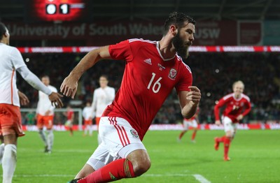 131115 - Wales v Netherlands, Vauxhall International Friendly - Joe Ledley of Wales celebrates scoring after Joe Allen of Wales has his penalty shot saved by Netherlands goalkeeper Jasper Cillessen