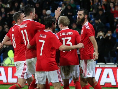 131115 - Wales v Netherlands, Vauxhall International Friendly - Joe Ledley of Wales celebrates scoring after Joe Allen of Wales has his penalty shot saved by Netherlands goalkeeper Jasper Cillessen