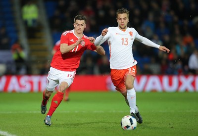 131115 - Wales v Netherlands, Vauxhall International Friendly - Tom Lawrence of Wales and Joel Veltman of Netherlands compete for the ball