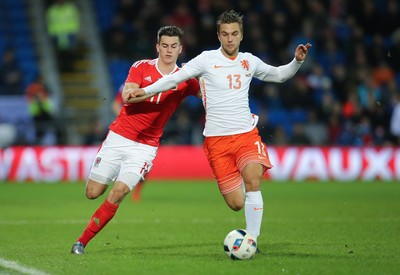 131115 - Wales v Netherlands, Vauxhall International Friendly - Tom Lawrence of Wales and Joel Veltman of Netherlands compete for the ball