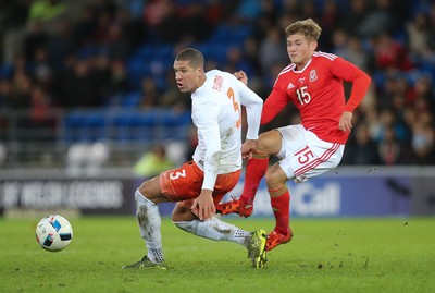 131115 - Wales v Netherlands, Vauxhall International Friendly - George Williams of Wales and Jeffery Bruma of Netherlands compete for the ball