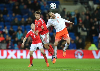 131115 - Wales v Netherlands, Vauxhall International Friendly - Adam Henley of Wales and Bas Dost of Netherlands compete for the ball