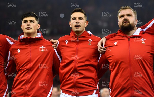 051122 - Wales v New Zealand - Autumn Nations Series - Louis Rees-Zammit, Owen Watkin and Tomas Francis during the anthems