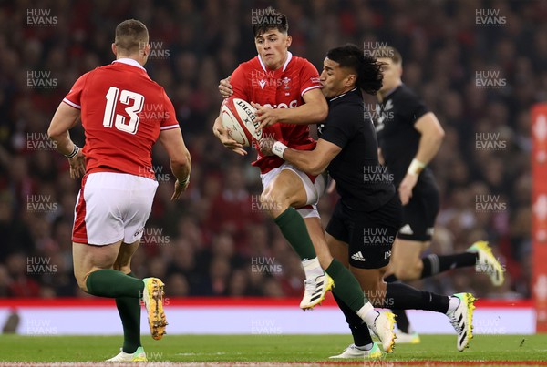 051122 - Wales v New Zealand - Autumn International Series - Louis Rees-Zammit of Wales is tackled by Rieko Ioane of New Zealand