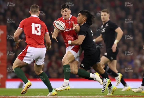 051122 - Wales v New Zealand - Autumn International Series - Louis Rees-Zammit of Wales is tackled by Rieko Ioane of New Zealand