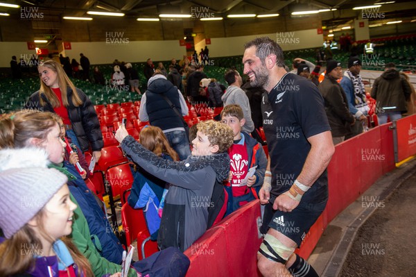 051122 - Wales v New Zealand - Autumn Nations Series - Samuel Whitelock of New Zealand poses for photos and signs autographs with fans