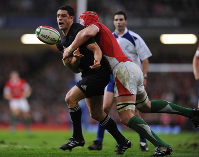 07.11.09 - Wales v New Zealand - Invesco Perpetual Series 2009 - Dan Carter of New Zealand is tackled by Alun Wyn Jones of Wales. 