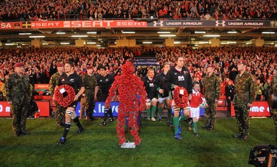 07.11.09 - Wales v New Zealand - Invesco Perpetual Series 2009 - All Blacks captain Richie McCaw and Wales captain Ryan Jones with mascot Jack Egan lead out their teams. 