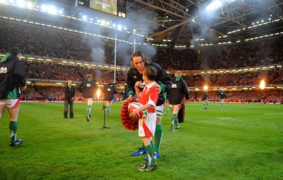 07.11.09 - Wales v New Zealand - Invesco Perpetual Series 2009 - Wales captain Ryan Jones leads out his team with mascot Jack Egan. 