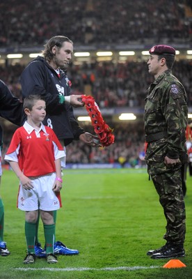 07.11.09 - Wales v New Zealand - Invesco Perpetual Series 2009 - Ryan Jones and mascot Jack Egan hand over a poppy wreath. 