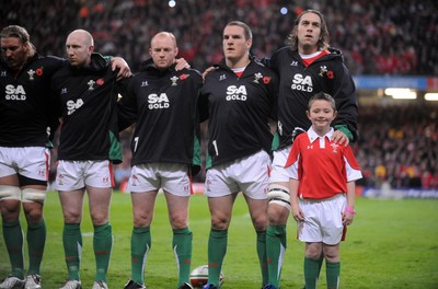 07.11.09 - Wales v New Zealand - Invesco Perpetual Series 2009 - Andy Powell, Tom Shanklin, Martyn Williams, Gethin Jenkins, Ryan Jones and mascot Jack Egan line up for the anthems. 