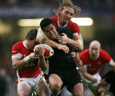 07.11.09  Wales v New Zealand... All Black's Mils Muliaina is tackled by Andy Powell and Shane Williams . 