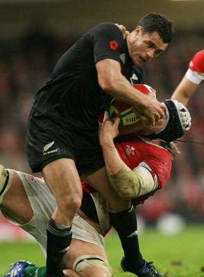 07.11.09  Wales v New Zealand... All Blacks Dan Carter is tackled by  Ryan Jones. 