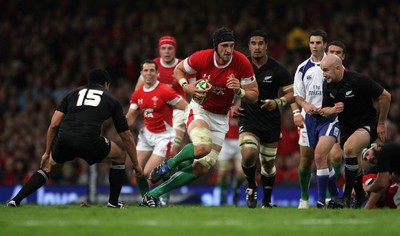07.11.09  Wales v New Zealand... Wales Luke Charteris gets past Mils Muliaina. 