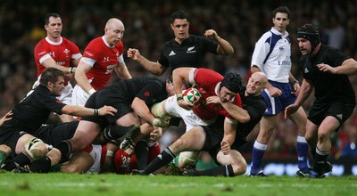 07.11.09  Wales v New Zealand... Wales Luke Charteris is tackled by Brendon Leonard. 