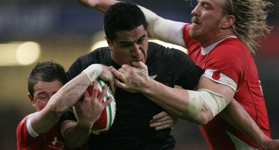 07.11.09  Wales v New Zealand... Mils Muliaina is tackled by Shane Williams and Andy Powell. 
