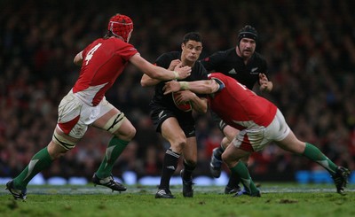 07.11.09  Wales v New Zealand... Dan Carter is tackled by Alu-Wyn Jones and Gethin Jenkins. 