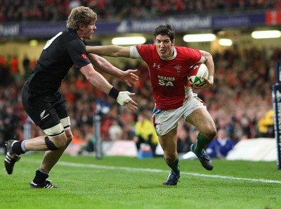 07.11.09... Wales v New Zealand, Invesco Perpetual Series Wales' James Hook is tackled by Adam Thomson 