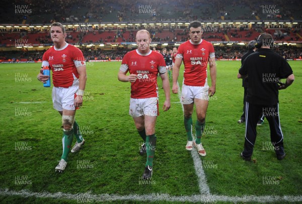 07.11.09 - Wales v New Zealand - Invesco Perpetual Series 2009 - Dafydd Jones, Martyn Williams and Jamie Roberts of Wales look dejected at the end of the game. 
