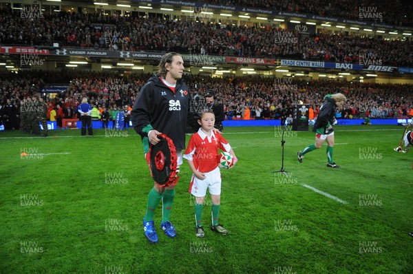 07.11.09 - Wales v New Zealand - Invesco Perpetual Series 2009 - Wales captain Ryan Jones leads out his team with mascot Jack Egan. 