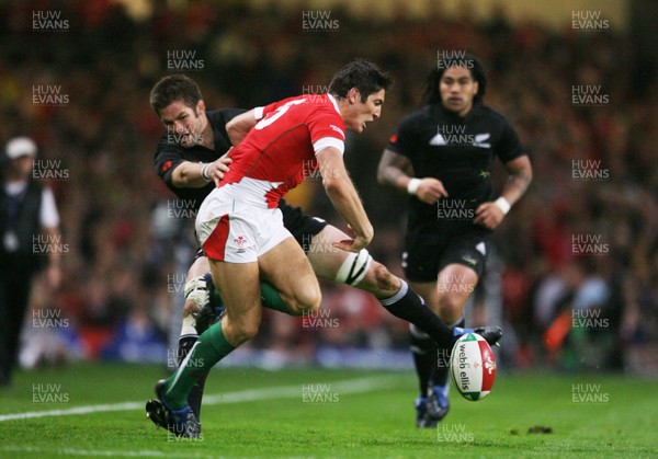 07.11.09  Wales v New Zealand... Wales James Hook is tackled by Richie McCaw 