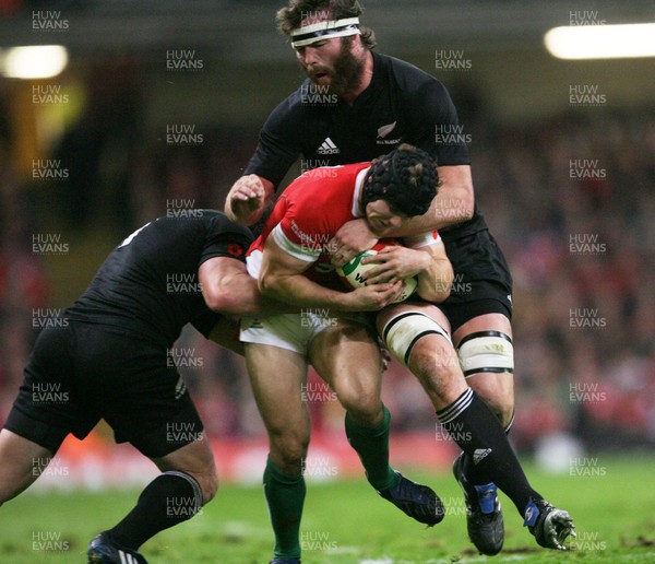 07.11.09  Wales v New Zealand... Wales Leigh Halfpenny is tackled by Wyatt Crockett and Jason Eaton. 