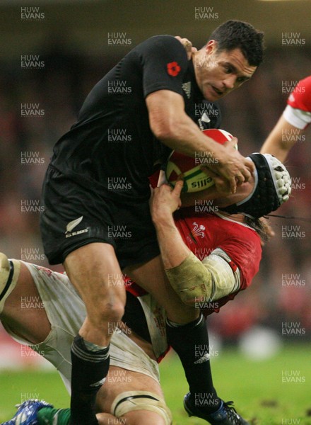 07.11.09  Wales v New Zealand... All Blacks Dan Carter is tackled by  Ryan Jones. 