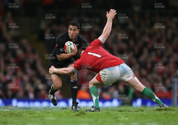 07.11.09  Wales v New Zealand... Mils Muliaina is tackled by Gethin Jenkins. 