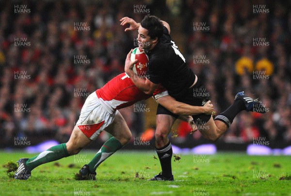 07.11.09 - Invesco Perpetual international Rugby, Wales v New Zealand Zac Guildford of New Zealand is tackled by Leigh Halfpenny 