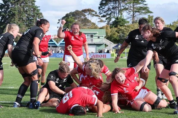 161022 - Wales v New Zealand, Women’s Rugby World Cup 2021, Pool A - Wales celebrate after Sioned Harries of Wales, hidden, scores try