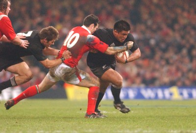20.11.04 - Wales v New Zealand New Zealand's Kevin Mealamu tries to get through a Stephen Jones tackle  